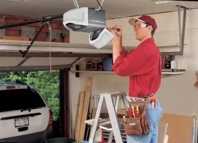 Technician installing a garage door opener